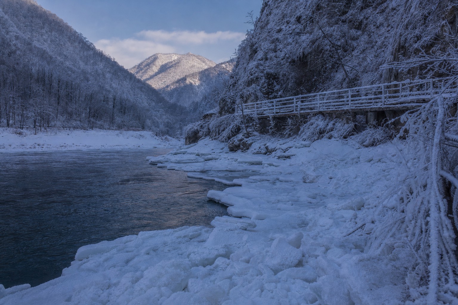 Ice piled at the base of the Niagara gorge in midwinter with no boats on the water